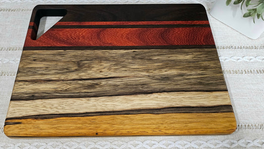 Cutting Board With Handle | Peruvian Walnut, African Padauk, & Black Limba Woods